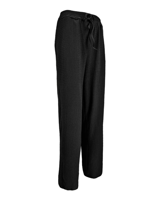 Wijde broek Rikki in zwart golf textuur